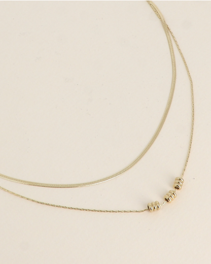 Collier double doré avec cylindres acier inoxydable SAM